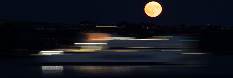 abstract_light_trials_as_buck_moon_rises_over_Plymouth_Sound