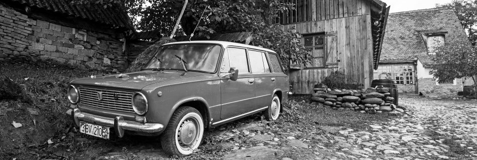 Vintage_Lada_2102_Soviet-era_station_wagon_parked_in_a_rustic_rural_setting