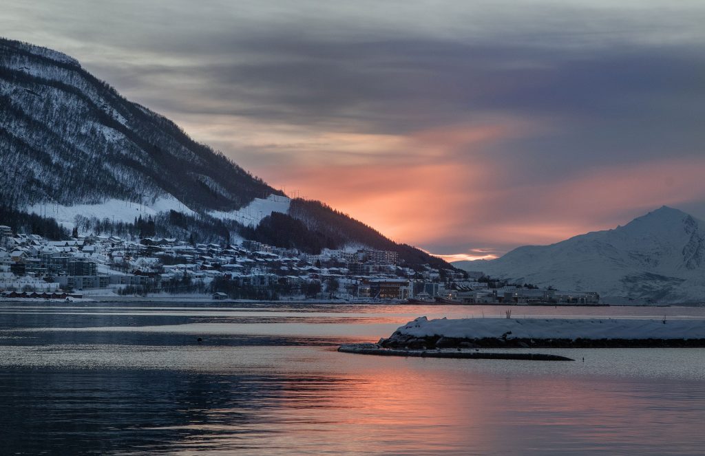View_of_Arctic_fjord_from_Tromsø_with_mountains_and_calm_waters