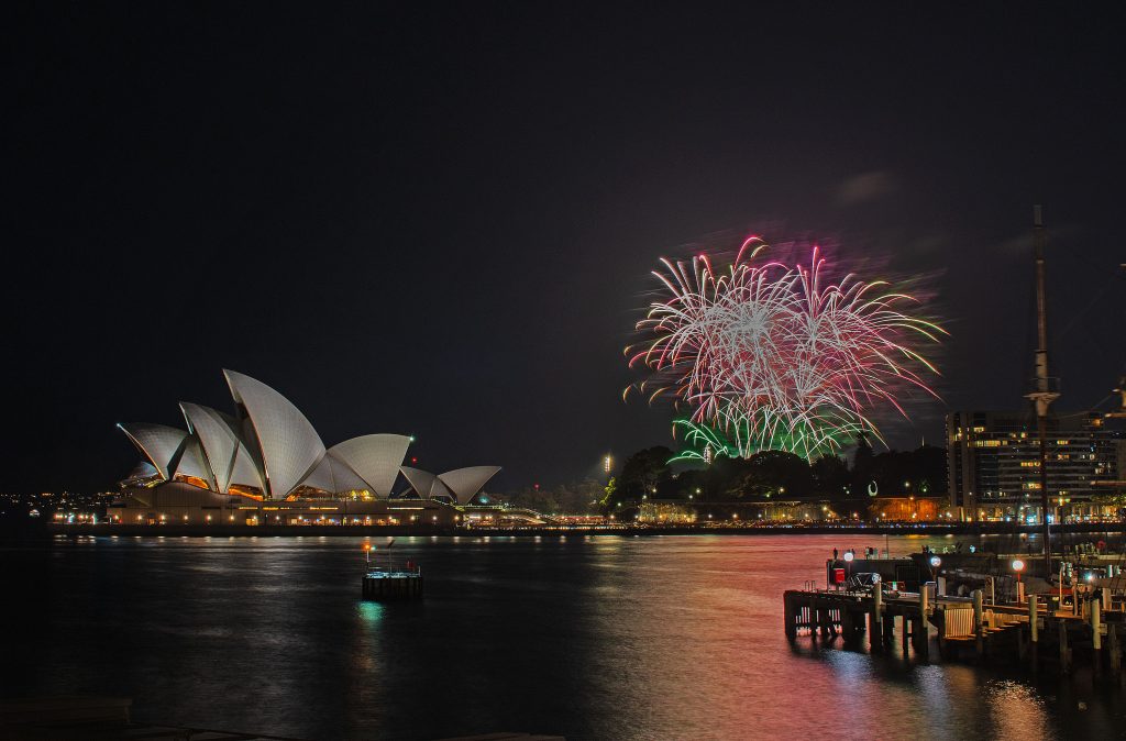 Sydney_Opera_House_at_night_with_fireworks_above_the_illuminated_harbour